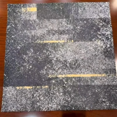 How do I fluff up a flattened nylon square rug?